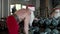 Santa claus making dumbbell snatches at gym. Sportsman workout in sport club