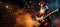 Santa Claus metalhead playing electric guitar at Christmas on festive background