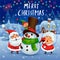 Santa Claus and Mrs.Claus building snowman in Christmas snow scene