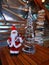 Santa Claus near artificial decorative fir