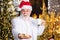 Santa Claus near christmas tree. Merry christmas. Bearded senior man Santa Claus. Santa Claus relaxing. Winter vacation