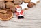 Santa Claus with nuts, oranges and cookies at the edge of wood