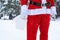 Santa Claus outdoor in winter and snow handing in hand paper bags with craft gift, food delivery. Shopping, packaging recycling,