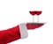 Santa Claus outstretched arm holding a silver serving tray with two glasses of red wine over a white background