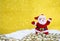 Santa Claus over blurred snowflake on gold background