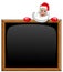 Santa claus peeping behind blank blackboard isolated