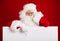 Santa Claus pointing in blank advertisement banner isolated on r