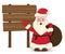 Santa Claus pointing in wood