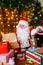 Santa Claus is preparing for Christmas, reading childrens letters. Mail of Santa Claus.