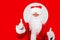 Santa Claus on red background makes thumbs up