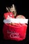 Santa Claus red bag with presents and gift showing Holiday Cheer. Isolated on black background