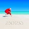 Santa Claus run at sandy ocean beach 2020 with Christmas sack