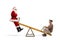 Santa Claus on a seesaw with an elderly gentleman