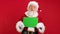 Santa Claus Shows an Approving Thumbs-up Gesture With Space for Text or Advertising on Red. Cheerful Santa Claus Holding