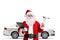 Santa claus with a silver car holding car repair tools