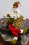 Santa Claus sits on vintage brouwn coffer with white christmas t