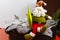 Santa Claus sits on vintage brouwn coffer with white christmas t