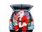 Santa Claus sitting in a Minivan with its rear door open and stuffed full with wrapped Christmas presents. Isolated on white