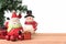 Santa claus and snowman with the gift and christmas tree