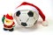 Santa Claus and the soccer ball on white