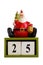 Santa claus statuette sitting on cubes showing the date 25 Isolated On White Background