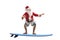 Santa Claus in swimming shorts on a surfboard