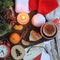 Santa Claus table with hat, gloves, glasses, letter, Christmas decorations and hot tea.