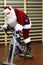 Santa Claus training on exercise bikes at the gym
