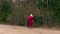 Santa Claus walking near apple tree