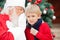 Santa Claus Whispering In Boy\'s Ear