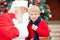 Santa Claus Whispering In Boy\'s Ear
