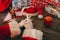 Santa Claus with white gloves at his wooden table