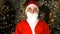 Santa Claus in wonder home interior looking at camera. Merry christmas