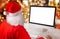 Santa Claus work on computer. Isolated, blank screen for mockup, app or web site presentation