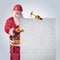 Santa Claus worker in helmet with poster