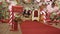 Santa Claus workshop, wrapped gifts presents boxes on holiday eve in night on xmas background. Red post box for letters