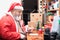 Santa Claus writing a letter on his busy desk