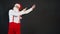 Santa claus yellow funky stylish, suspenders fast background man december hat red cheerful, points up on a black