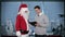 Santa Claus and Young Businessman in a modern office, stock footage