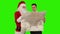 Santa Claus with a Young Businessman reading a map, Green Screen, stock footage