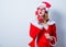 Santa Clous girl with eyeglasses and handset