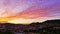 Santa Coloma, Barcelona, Spain at sunset. Time-lapse. Colorful cirrocumulus in the sky, city night view