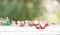 santa doll and presents with snow decorated background blurred group of santa claus dolls