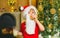 Santa fun. Merry Christmas. Santa - funny child picking cookie. Santa Claus takes a cookie on Christmas Eve as a thank