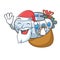 Santa with gift diving submarine in the mascot sea