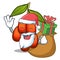 Santa with gift jujube fruit above character wooden table