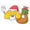 Santa with gift orange jelly candy mascot cartoon