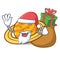 Santa with gift planet saturnus mascot cartoon