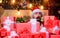 Santa with gifts. Bearded Santa Claus and many holiday packages. Best prices for winter gifts. Seasonal offer. Christmas