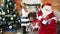 Santa giving christmas gift for little girl, kid visiting saint nicolas winter residence, presents